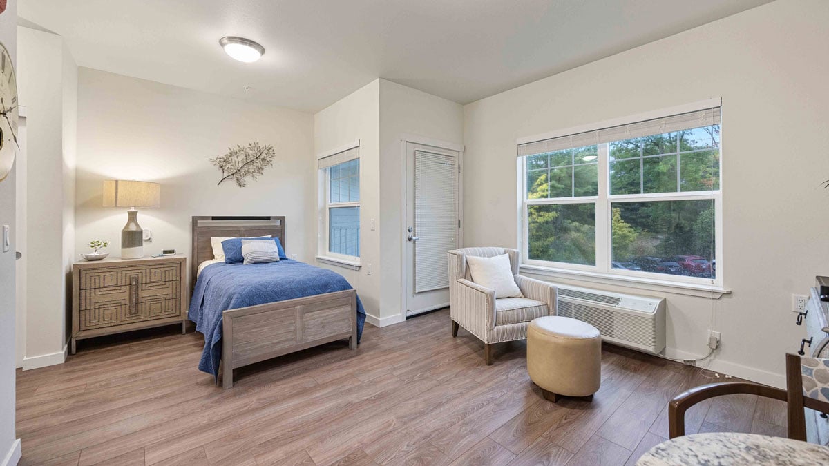 A furnished bedroom in a Colonial Harbor apartment